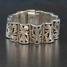 This vintage Taxco sterling silver patterned link bracelet is stunning. This bracelet is very detailed and finely crafted with a beautiful open work pattern. This piece is gorgeous on and would brighten any outfit!Vintage BraceletSterling SilverTaxcoSterling SilverDimensions: 7 1/2" long by 1" widePlease read our shop policies prior to purchase. Thanks for looking and contact us with any questions. Silver Filigree Luxury Bracelet, Classic Sterling Silver Bangle With Intricate Design, Luxury Silver Filigree Bracelet, Carved Sterling Silver Bracelets, Elegant Silver Carved Bracelets, Elegant Silver Bracelets With Carved Details, Luxury Silver Bracelet With Intricate Design, Elegant Sterling Silver Bracelet With Intricate Design, Elegant Engraved Antique Silver Bracelets