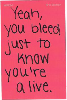 a pink sign with black writing on it that says yeah you bleed just to know you're alive