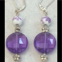 Ceramic Floral Beads With Acrylic Purple Beads And Silver Plated Flower Beads, Hanging From A Nickel Free Lever Back Earring. Matching Bracelet Sold Separately. Elegant Purple Beaded Earrings With Faceted Beads, Nickel-free Purple Beaded Earrings With Round Beads, Nickel-free Purple Beaded Earrings, Purple Faceted Beaded Round Earrings, Purple Faceted Beaded Earrings, Purple Czech Glass Earrings With Faceted Beads, Purple Faceted Round Bead Earrings, Purple Earrings With Faceted Round Beads, Chip Bead Jewelry