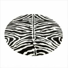 a black and white zebra print area rug on a white background with an oval shape