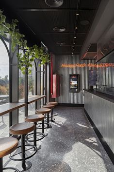 a row of bar stools sitting next to each other