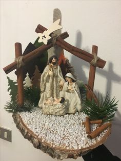 a nativity scene made out of wood and rocks