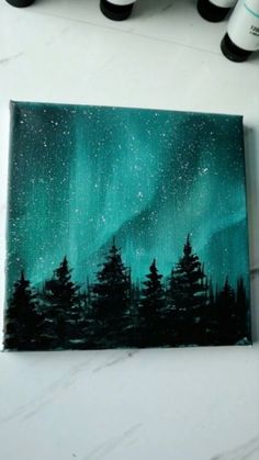 an acrylic painting of trees and the northern lights