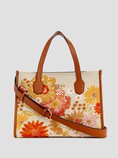 Canvas Tote Beaded floral print exterior Shiny gold-tone hardware Enameled triangle logo Multiple interior pockets Zip-top closure Guess Models, Foundation Brands, Guess Kids, Pretty Bags, Triangle Logo, Guess Jeans, Zip Top, Tote Handbags, Canvas Tote