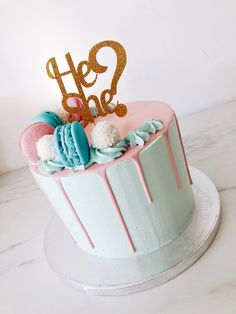 a cake with frosting and decorations on top