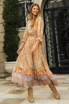 This tiered maxi dress has a sunny '70s vibe in a retro-inspired floral print with an ornate border at the hem. It's designed with self-tie neckline, three-quarter sleeves, and a cinched waist. •Split neckline with self-tie •Three-quarter sleeves •Ruffled cuffs •Elasticized waist •Tiered skirt Item Number: 99767 Ornate Border, Fall Floral Dress, Dress 2024, Classy Wedding, Modest Fashion Outfits, Tiered Maxi Dress, Christmas 2023, Wedding Guests, Formal Outfit