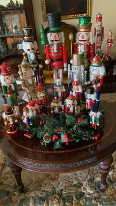 nutcrackers and christmas decorations on a table in a living room or dining room