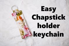 a keychain with the words easy chapstick holder keychain on it