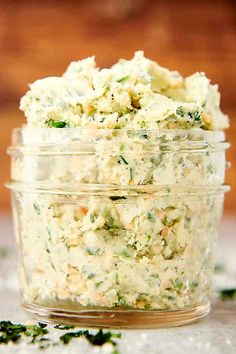 a glass container filled with food sitting on top of a table