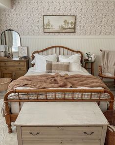 a bed sitting in a bedroom next to a dresser