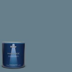 a can of marquee paint on a green background