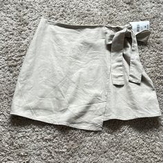 Super Cute Skirt For Summer/Fall! Tan Linen Like Material Chic Mini Skort With Tie Waist, Trendy Mini Wrap Skirt For Spring, Trendy Mini Wrap Skirt For Day Out, Summer Mini Skort With Tie Waist, Casual Mini Wrap Skirt For Day Out, Trendy Skort For Brunch, Spring Mini Skirt With Tie Waist, Spring Mini Skort With Tie Waist, Casual Tie Waist Mini Wrap Skirt