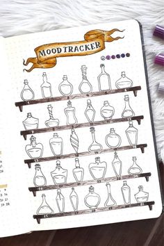 an open notebook with drawings of bottles and jars on the shelf next to some crayons