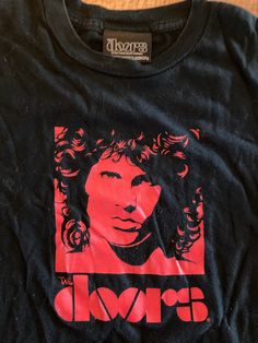 2002 T-shirt featuring Jim Morrison from The Doors, with a The Doors brand tag.  T-shirt is in good condition.  The size is Youth XL -- Would also translate to a women's small. The Doors Shirt, Jim Morrison, Brand Tags, The Doors, Shirt Outfit, Tee Shirt, Gender Neutral, Doors, Adult Outfits