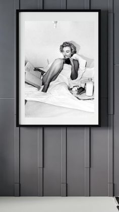 a black and white photo hanging on the wall