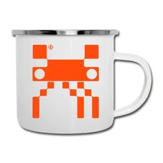 an orange and white coffee mug with a robot design on the inside, in front of a white background