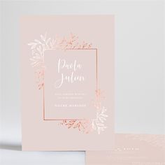 a pink wedding card with gold foil on the front and back, featuring an elegant floral design