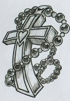 a drawing of the letter f with beads around it and a cross in the middle