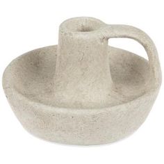 a white bowl with a handle on the side and a small cup in the middle