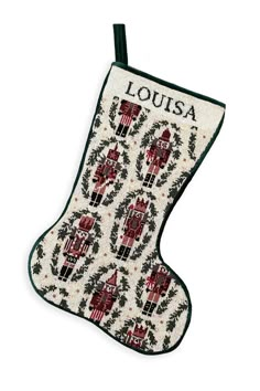 an embroidered christmas stocking with the name louisa written in black and red on it