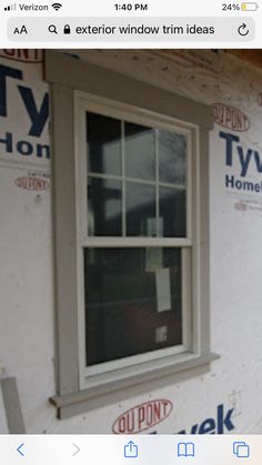 an image of a window being installed on the side of a house that is under construction