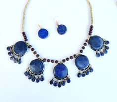 afghan lapis lazuli necklace,vintage rare necklace,tribal jewelry,boho necklace,waterfall necklace,Kuchi necklace,women long necklace,gift *you have the option of buying together or as set. Afghan Vintage rare necklace. This unique necklace is handmade with genuine Afghan lapis lazuli stone. The waterfall design and charm teardrop tassels  are inspired by kuchi jewelry. This necklace is definitely an eye-catching piece to refresh your look with any outfit. The deep blue colour of lapis lazuli is Bohemian Festive Jewelry With Natural Stones, Bohemian Round Jewelry Sets For Festivals, Handmade Bohemian Brass Jewelry Sets, Handmade Lapis Lazuli Jewelry For Festivals, Bohemian Beaded Jewelry Sets For Festive Occasions, Bohemian Jewelry Sets For Festivals, Traditional Blue Jewelry With Natural Stones, Blue Lapis Lazuli Jewelry For Festivals, Traditional Blue Natural Stone Jewelry