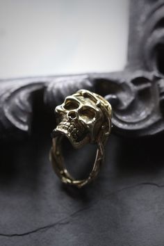 Skull with thorn ring by Defy. - The Skull dimensions are approx. 2x2.8 cm. - The Ring size is adjustable between 7-10 US. - Material : Brass / Silver **Free Shipping to World Wide** - Please allow us to prepare the item and parcel between 3-5 working days. For Brass / Silver plated / Gold plated (Between 5-7 working days For Sterling Silver 925) (Between 7-10 working days For Special items Sterling Silver925 with Hand painted) - All items will be sent by Thai Registered Airmail. The delivery us Thorn Ring, Dark Style, Human Skull, Skull Ring, Brass Gold, Dark Fashion, Matching Bracelets, Star Necklace, Rings Statement