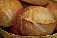 several loaves of bread sitting in a basket