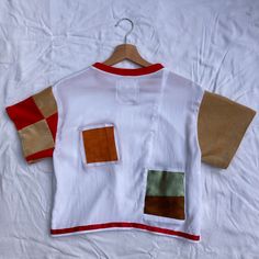 T-shirt made of second-hand fabrics. Red and gold patchwork, velvet sleeves. Finished with our 'Lenny and Wy' Lino-print label. Patchwork Word Shirt, White Patchwork T-shirt With Relaxed Fit, Red Vintage Tops With Patchwork, Vintage White Patchwork Tops, Casual Red T-shirt With Patchwork, Vintage Red Tops With Patchwork, Red Patchwork Short Sleeve Tops, Short Sleeve Reworked Cotton Tops, Red Cotton Patchwork Top