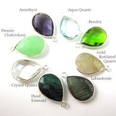 Frame Material: Solid Genuine .925 Sterling Silver. Shape: Faceted pear shape on both sides. Measurement: 22mm long 15mm wide, stone size is 13x18mm. Weight: 2.2 grams per piece. SKU#: 201110 Quantity : 1 pcs Available Stones: Amethyst Quartz Aqua Quartz Aqua Chalcedony Blue Topaz Black Rutilated Quartz Blue Sapphire Dyed Citrine Quartz Crystal Quartz Emerald Dyed Garnet Green Amethyst Quartz Green Onyx Gold Rutilated Quartz Iolite Quartz Lemon Quartz Labradorite Rainbow Moonstone Opalite Perido Teardrop Birthstone Gemstones For Gifts, Teardrop Birthstone Gemstones For Anniversary, Teardrop Anniversary Birthstone Gemstones, Silver Faceted Briolette Gemstones, Sterling Silver Teardrop Gemstones Gift, Faceted Briolette Silver Gemstones, Silver Briolette Jewelry For May Birthstone, Personalized Silver Teardrop Jewelry, Silver Teardrop Gemstones