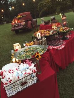 a table with food on it in the grass