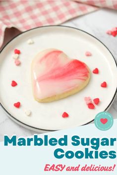 a heart shaped sugar cookie on a plate