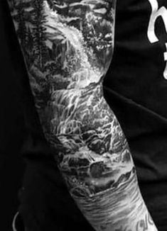 a man with tattoos on his arm and arms