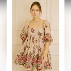 A Pretty Little Floral Mini Dress For Your Next Spring/Summer Event. Dress It Up With Heel Sandals Or Dress It Down With Sneakers. Accessorize It With Your Favorite Pretty Little Headband. It Features A Square Neckline, 3/4 Puffy Sleeves, And Bust Darts. It Also Has A Gathered Waist And A Back Zipper For Of/On Access. 50% Cotton, 50% Polyester. Red Puff Sleeve Dress For Garden Party, Beige Puff Sleeve Mini Dress For Garden Party, Red Puff Sleeve Mini Dress For Spring, Beige Floral Print Mini Dress With Puff Sleeves, Beige Puff Sleeve Mini Dress With Floral Print, Cute Red Puff Sleeve Dresses, Summer Mini Dress With Puff Sleeves For Garden Party, Beige Puff Sleeve Summer Dress, Beige Summer Dress With Puff Sleeves