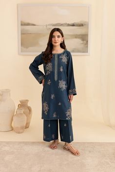 Batik Embroidered Lawn Dress Adira 2Pc Embrace tradition with our Pakistani outfits online. This ready-to-wear 2Pc dress in premium Pima lawn features a straight fit shirt with an embroidered neckline and composed motifs. The loose fit sleeves are adorned with embroidered borders and lace. Paired with embroidered cambric culottes, it captures the essence of celebration. Premium Pima lawn Embroidered neckline Straight fit shirt Embroidered cambric culottes Note: Colors may slightly vary due to li Blue Long Sleeve Palazzo Set With Floral Embroidery, Indigo Traditional Wear For Eid, Traditional Indigo Sets With Resham Embroidery, Blue Palazzo Set With Intricate Embroidery And Long Sleeves, Blue Palazzo Set With Intricate Embroidery, Indigo Sets With Resham Embroidery For Eid, Blue Long Sleeve Palazzo Set With Intricate Embroidery, Eid Indigo Sets With Resham Embroidery, Indigo Floral Embroidered Kurta For Eid