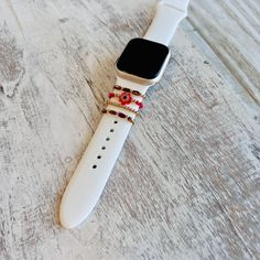 an apple watch on a white wooden surface