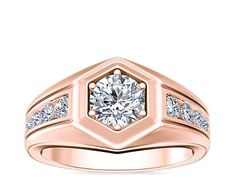 a rose gold ring with diamonds on the sides and a center diamond in the middle