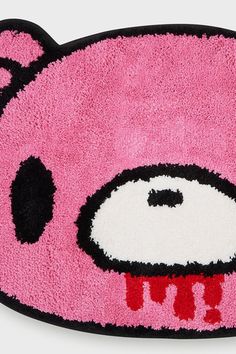 a pink rug with an animal face on it