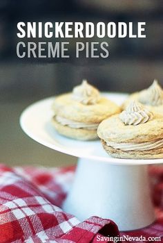 a white plate topped with cookies on top of a red and white checkered table cloth