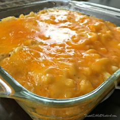 a glass casserole dish filled with macaroni and cheese