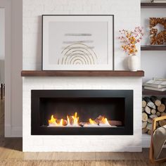 a fire place in a living room next to a wall with pictures on the mantle