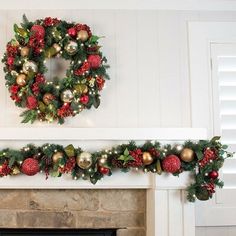 a fireplace decorated for christmas with wreaths and ornaments