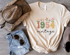 a t - shirt that says, 1950 vintage with flowers on it