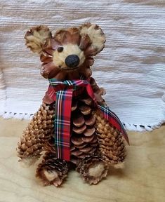 a teddy bear made out of pine cones