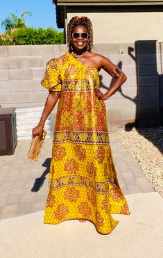 Our new African dress is a loose fit, one shoulder, and adds elegance and style to your wardrobe.  The beautiful metallic gold finish on this Ankara fabric adds a touch of class and sophistication to your outfit! 🔸 We can accommodate minor style changes, please contact us with any questions. *️⃣ MEASUREMENT GUIDE: See inserted pics We are happy to answer any questions regarding measurements and styles before purchase. Note - the customer is responsible for including their measurements or select Gold Dress With Asymmetrical Neckline, Chic One-shoulder Gold Dress, Gold One-shoulder Maxi Dress For Party, Chic Gold One-shoulder Dress, Gold One-shoulder Maxi Dress, Bohemian Gold Floor-length Dress, Yellow Ankara Fabric Maxi Dress, Yellow Long Sleeve Printed Kaftan, Festive Multicolor Maxi-length Kaftan