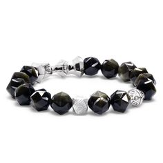 This men's beaded bracelet is a blend of cosmic wonder and earthly elegance, adorned with 84 finely-faceted golden obsidian beads and meteorite cubic bead. The Viking-era anchor-shaped sterling silver lobster clasp adds a historical touch, while the invisible elastic cord offers ease and comfort. A piece for the visionary, the strong, and the curious. Cosmic Connection Genuine meteorite fragments, a touch of the universe on your wrist. Elegance and Ease 84 finely-faceted Golden Obsidian beads, s Elegant Obsidian Jewelry With Polished Beads, Luxury Beaded Bracelets With Faceted Beads, Luxury Sterling Silver Beaded Bracelets, Luxury Faceted Beaded Bracelets, Modern Silver Bracelets With Gemstone Beads, Luxury Silver Bracelets With Gemstone Beads, Luxury Sterling Silver Round Bead Bracelets, Luxury Silver Onyx Bracelets, Silver Obsidian Bracelets With Natural Stones