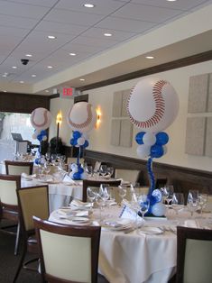 a baseball themed party with balloons and table settings