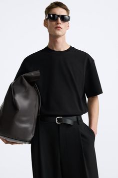 REGULAR FIT INTERLOCK T-SHIRT - Black | ZARA United States Classic Short Sleeve Workwear T-shirt, Zara Short Sleeve Workwear Shirt, Zara Short Sleeve Shirt For Work, Zara Short Sleeve Work Shirt, Classic Short Sleeve T-shirt For Work, Modern Relaxed Fit Short Sleeve T-shirt, Zara Short Sleeve Tops For Work, Modern Cotton T-shirt With Short Sleeves, Modern Short Sleeve Workwear T-shirt