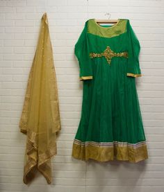 *Parrot green and gold *Readymade 3 Piece Suit Set: Comes with dupatta & skinny pants *Readymade Size Bust 44inches - please message us for size customization options *Material: Net *Color May Vary Slightly From Picture *Our store is located in Los Angeles and in store pick up is welcome Designer Green Anarkali Set For Navratri, Green Anarkali Set For Navratri Designer Wear, Green Anarkali Set With Pallu, Green Chanderi Churidar With Sheer Dupatta, Designer Anarkali Set In Green, Green Kurta With Sheer Dupatta For Festivals, Diwali Green Kurta With Sheer Dupatta, Green Anarkali Churidar With Sheer Dupatta, Green Anarkali Set With Traditional Drape