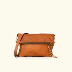 Womens Foldover Clutch - Crossbody Bag | Buffalo Jackson Cognac Flap Bag With Leather Lining For Everyday Use, Brown Flap Bag For Everyday Use, Brown Saddle Bag With Adjustable Strap For Everyday, Dark Tan Leather Crossbody Shoulder Bag, Brown Crossbody Flap Bag For Travel, Brown Crossbody Flap Bag With Adjustable Strap, Leather Shoulder Bag With Detachable Strap In Dark Tan, Brown Leather-lined Flap Bag For Everyday Use, Cognac Leather Flap Bag For Travel